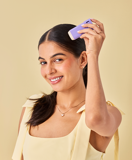 Woman with smilling face is posing with Frizz Control Stick