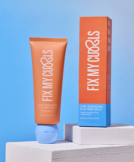 Tube and box of 'Fix My Curles' Curl Quenching Flax Seed Gelly on a blue background