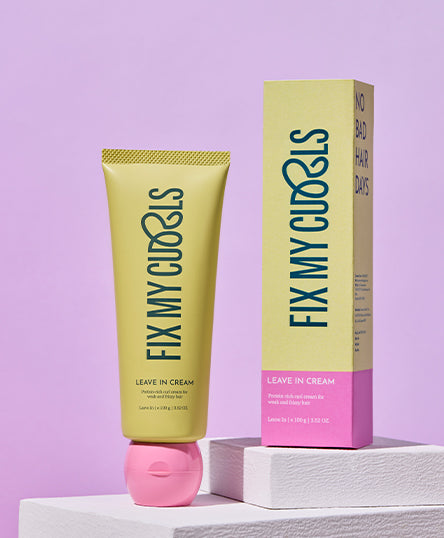 Leave-in cream tube and packaging with 'Fix My Curls' branding on a light purple background