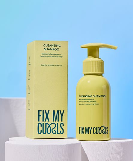 Cleansing shampoo of Fix My Curls branding on a light blue background is in the image