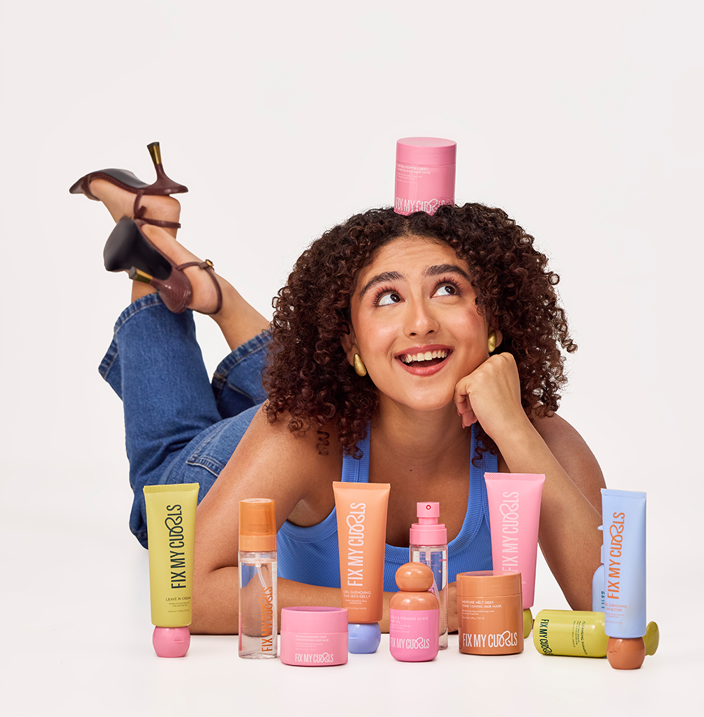 The founder of Fix My Curls Anshita is posing with the brand products