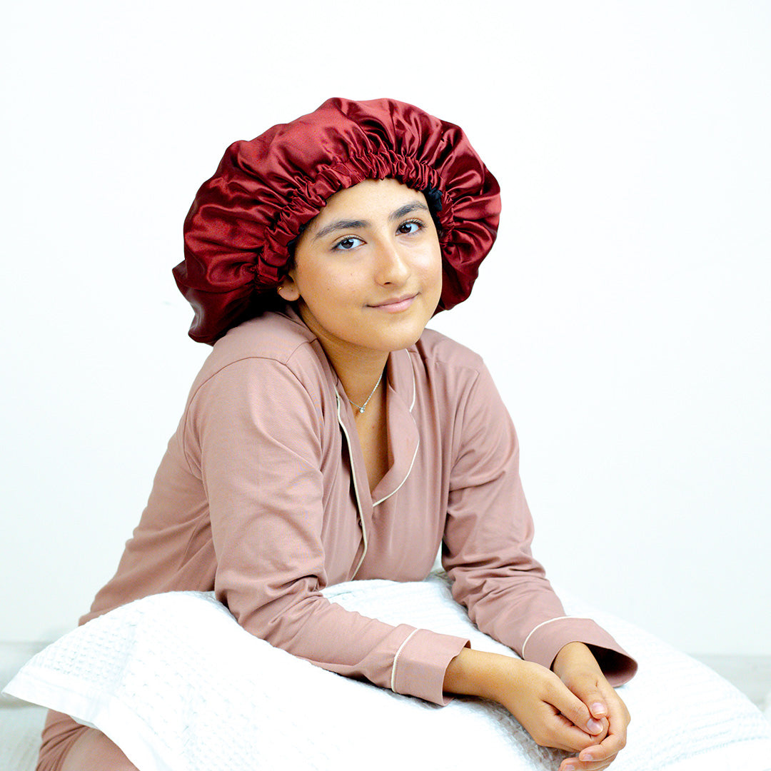 Woman wearing a Red Italian Satin Bonnet