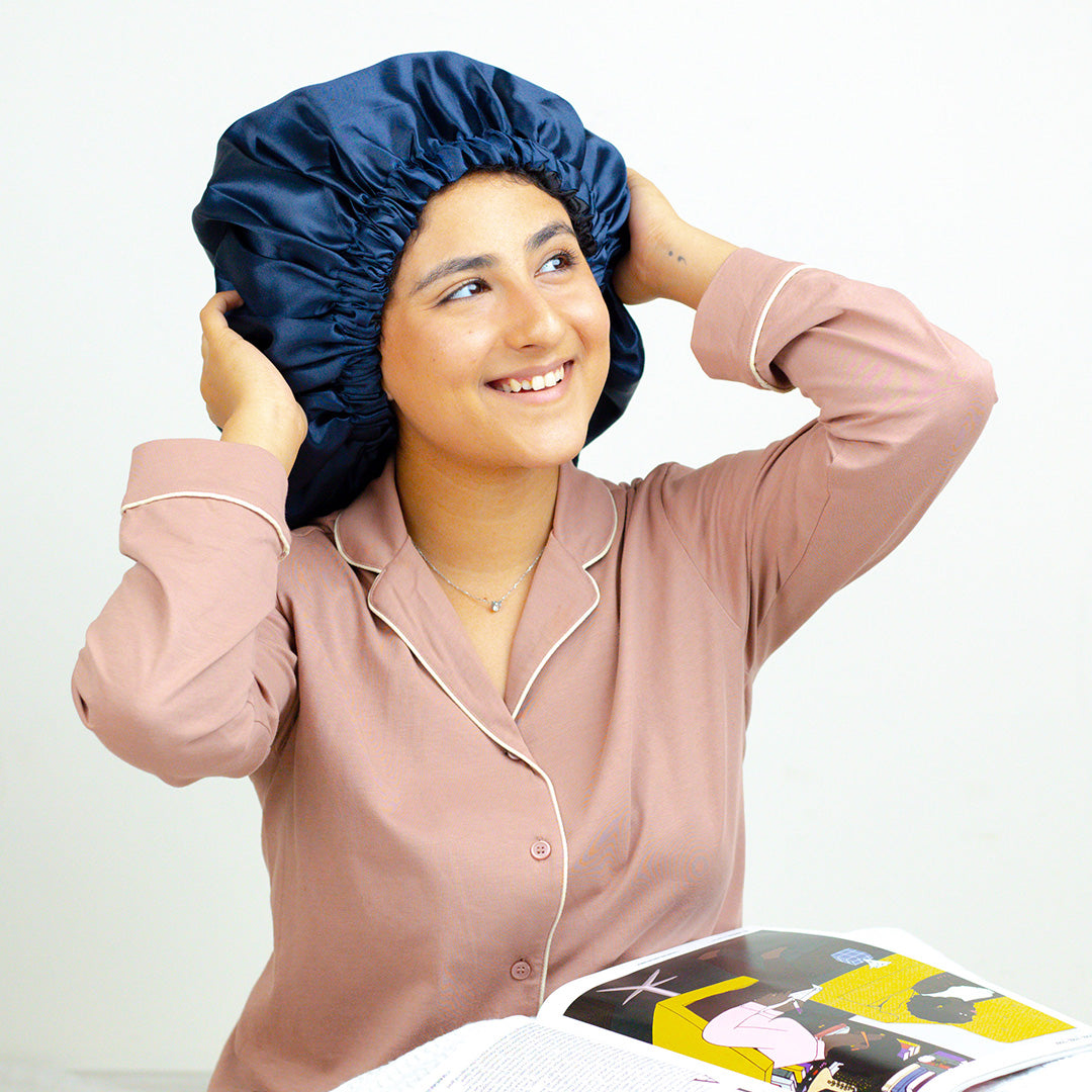 Woman smiling in a Blue Italian Satin Bonnet